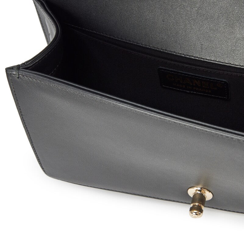 Chanel —  Black Vertical Quilted Calfskin Old Medium Pearl Boy Bag Light Gold Hardware, 2019