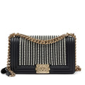 Chanel —  Black Vertical Quilted Calfskin Old Medium Pearl Boy Bag Light Gold Hardware, 2019